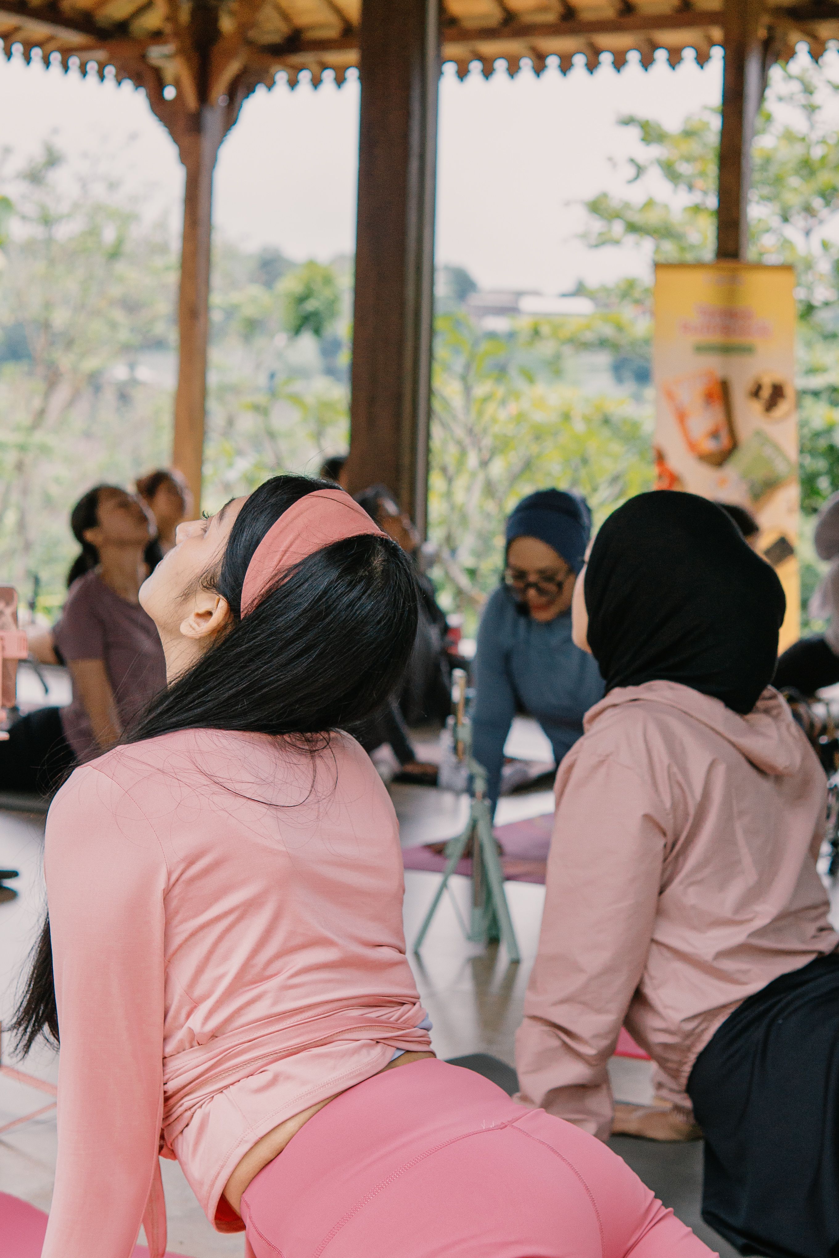 Women in pink at a group yoga class